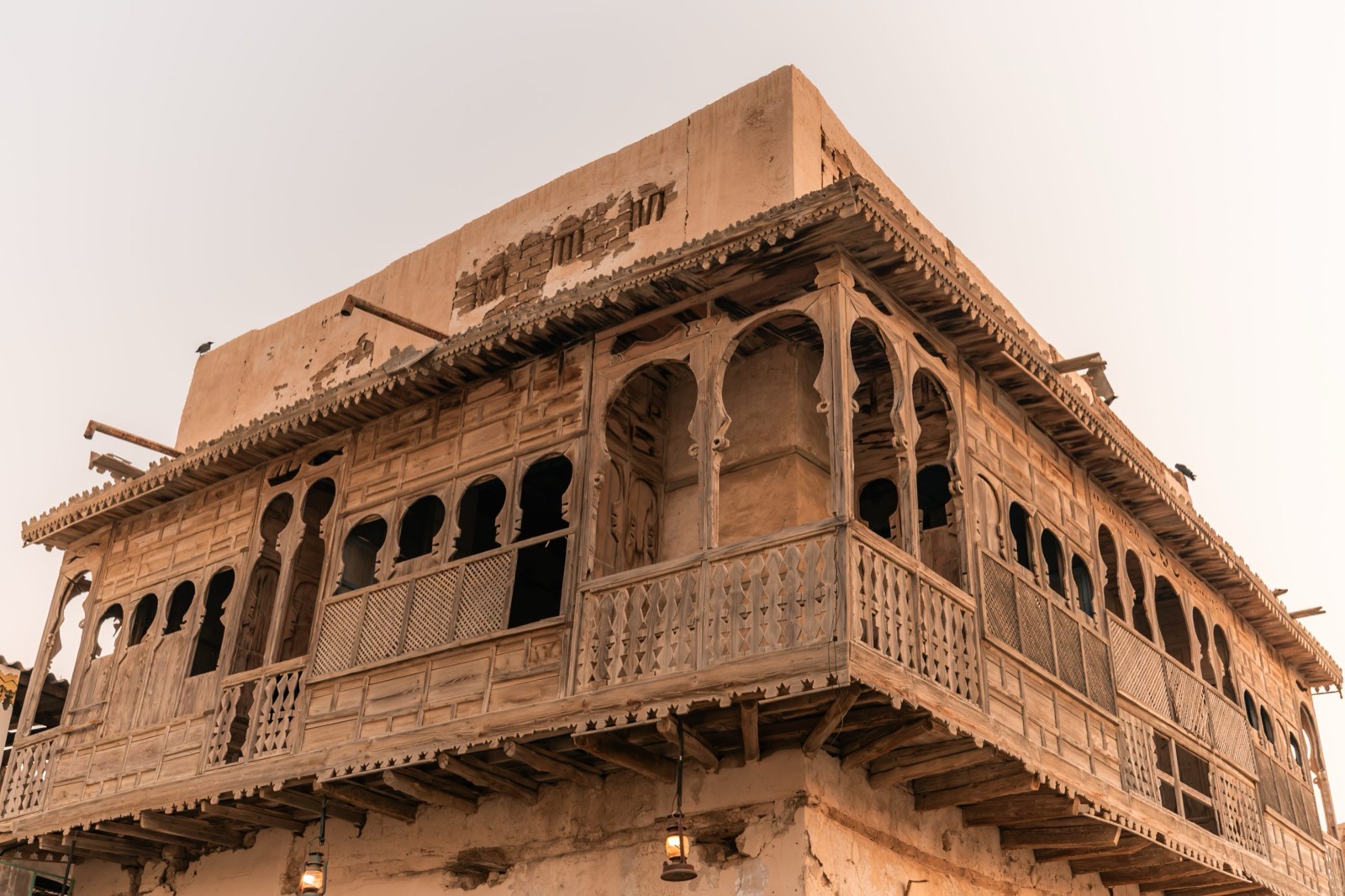 Carved wooden balconies of a coral-stone house in Old Yanbu